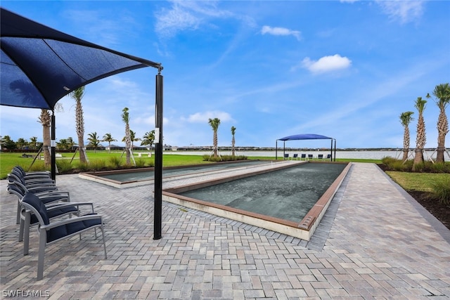 view of swimming pool with a water view