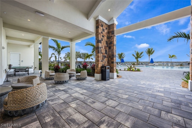 view of patio with a water view