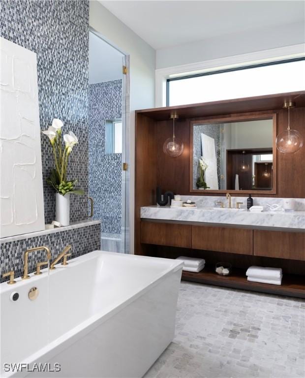 bathroom with a bathing tub and vanity