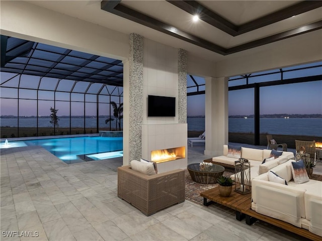 pool at dusk featuring a fireplace