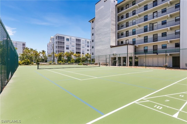 view of sport court with basketball hoop