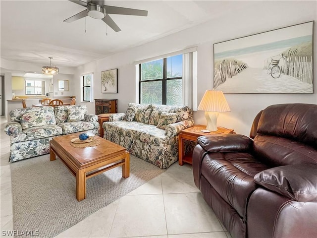 tiled living room featuring ceiling fan