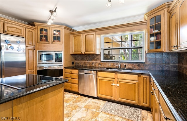 kitchen with sink, stainless steel appliances, tasteful backsplash, dark stone counters, and ornamental molding