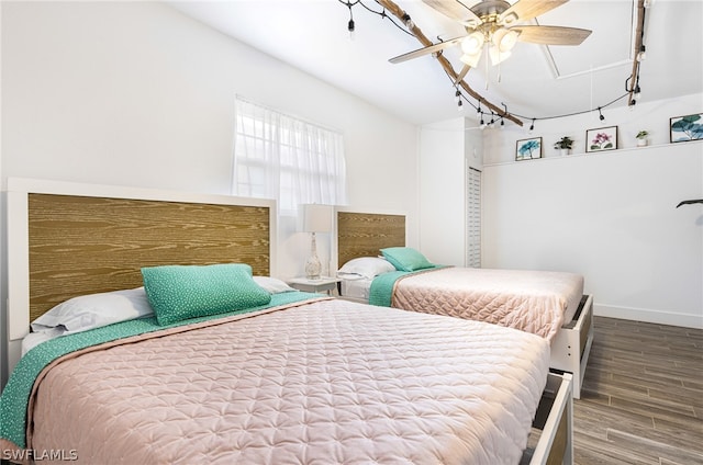 bedroom with hardwood / wood-style floors and ceiling fan