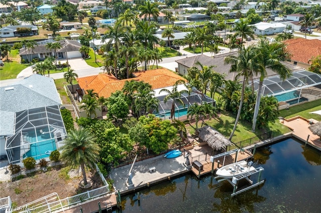 birds eye view of property with a water view