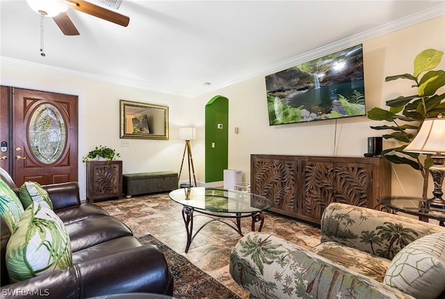 living room featuring ceiling fan and ornamental molding