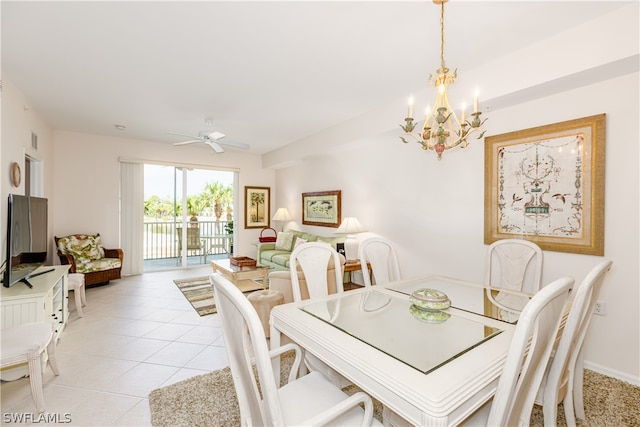 dining room featuring ceiling fan with notable chandelier and light tile patterned floors