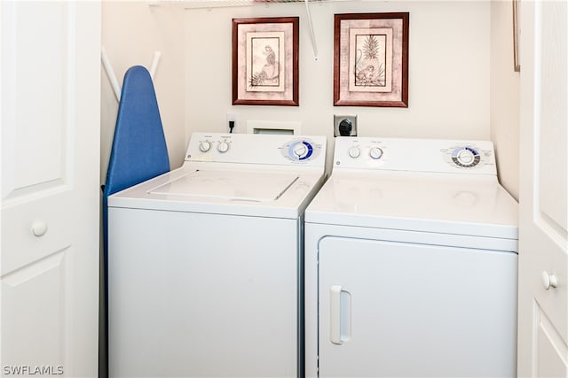 laundry area with washing machine and dryer