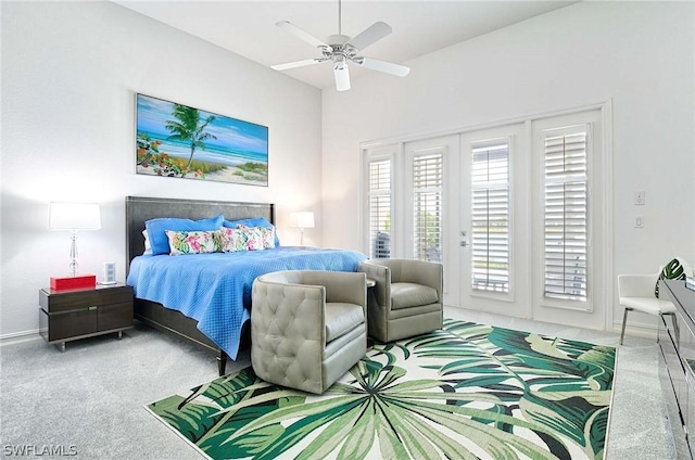 bedroom with carpet, ceiling fan, and access to outside