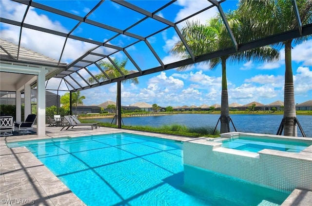 view of pool featuring glass enclosure, a water view, an in ground hot tub, and a patio