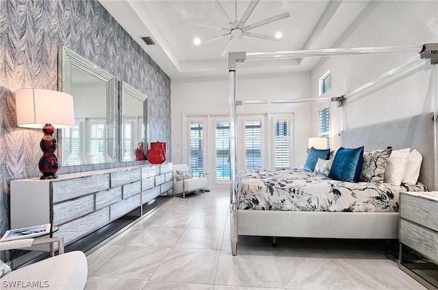 bedroom featuring ceiling fan and access to exterior