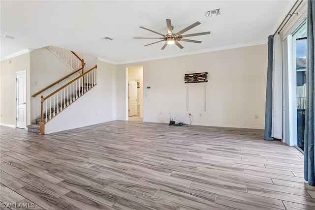 unfurnished living room featuring ceiling fan, crown molding, and light hardwood / wood-style flooring