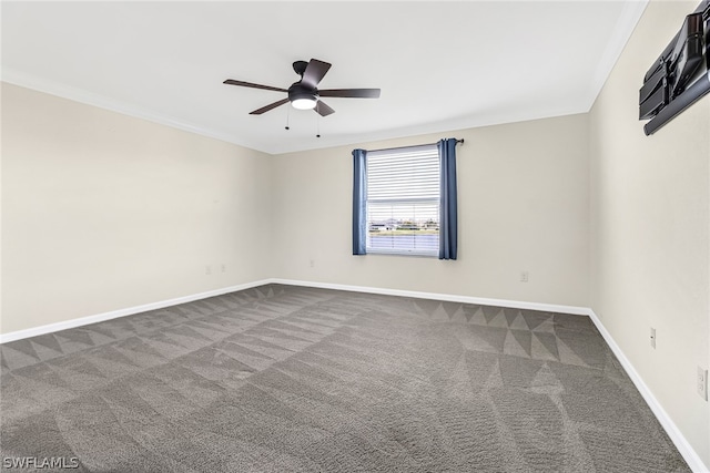 carpeted empty room featuring ceiling fan and ornamental molding