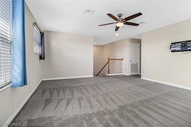 carpeted empty room with ceiling fan