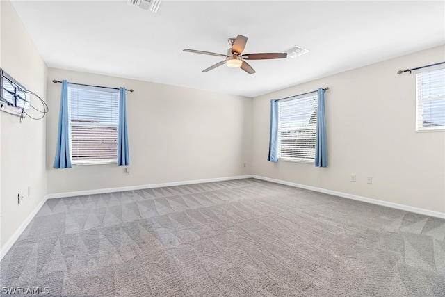 carpeted empty room with ceiling fan