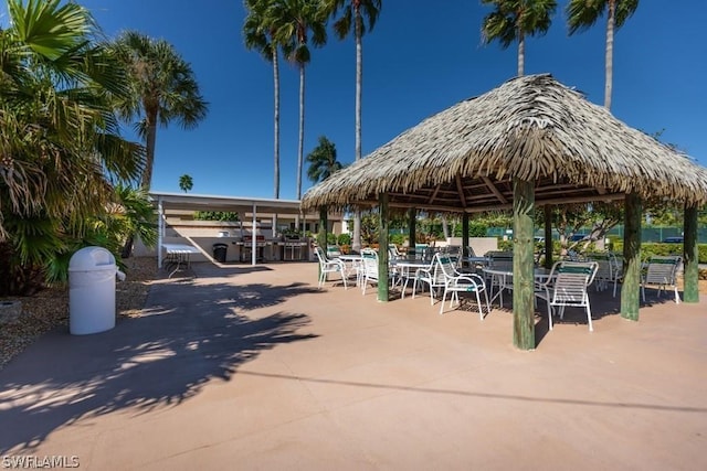 view of property's community with a gazebo and a patio area