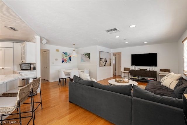 living room with light hardwood / wood-style floors