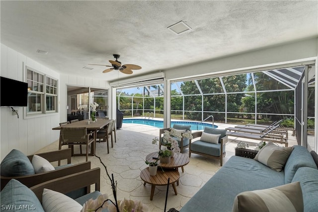 sunroom / solarium with ceiling fan