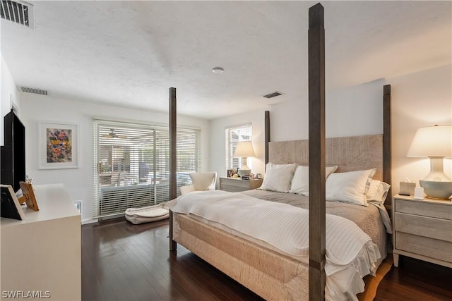 bedroom featuring dark wood-type flooring