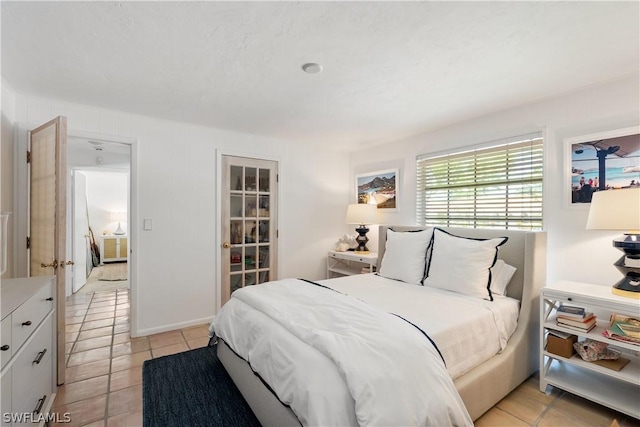 bedroom with light tile patterned floors