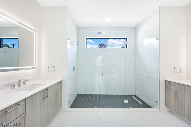 bathroom featuring vanity and an enclosed shower