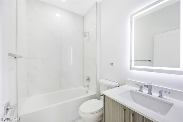 full bathroom with tiled shower / bath combo, toilet, and vanity