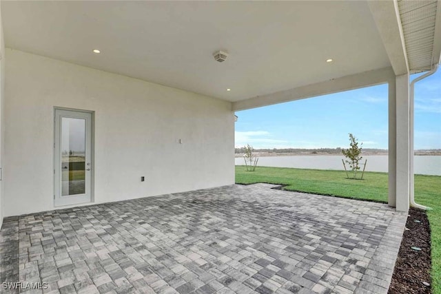 view of patio / terrace with a water view