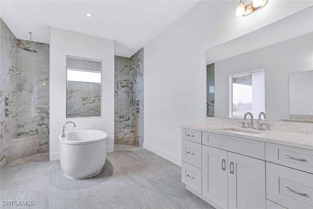 bathroom featuring vanity and separate shower and tub