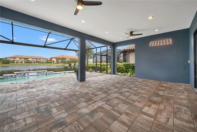 view of patio / terrace featuring a lanai, an outdoor pool, and ceiling fan