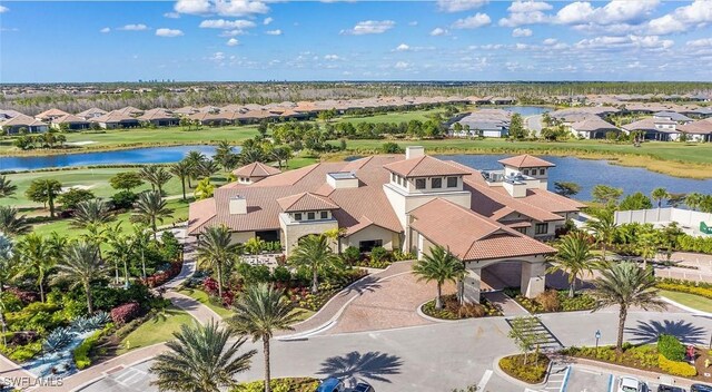 birds eye view of property with a residential view and a water view