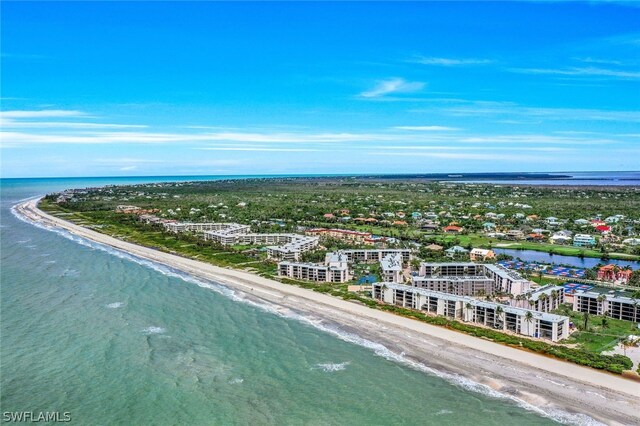 aerial view with a water view and a view of the beach