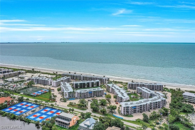 birds eye view of property featuring a water view and a view of the beach