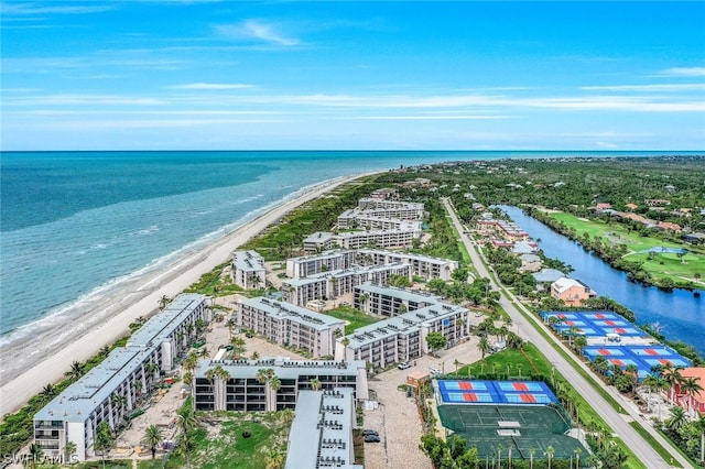 drone / aerial view with a water view and a view of the beach