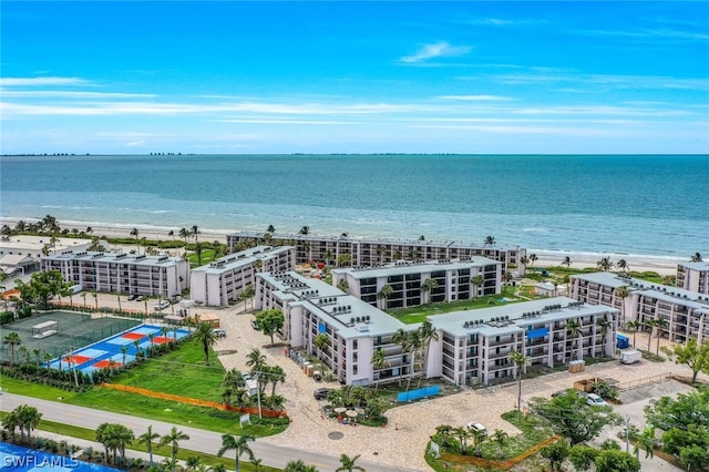 aerial view with a view of the beach and a water view