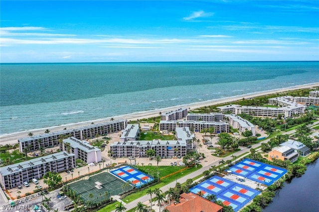 birds eye view of property featuring a water view and a view of the beach