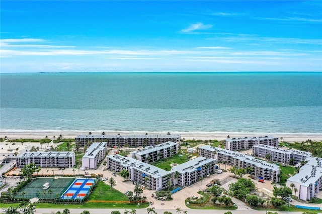 birds eye view of property featuring a water view and a view of the beach