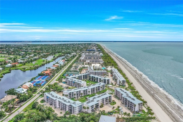 drone / aerial view featuring a view of the beach and a water view