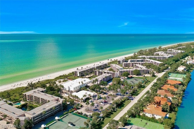 bird's eye view with a beach view and a water view