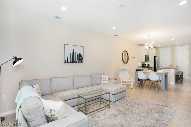 living room with an inviting chandelier