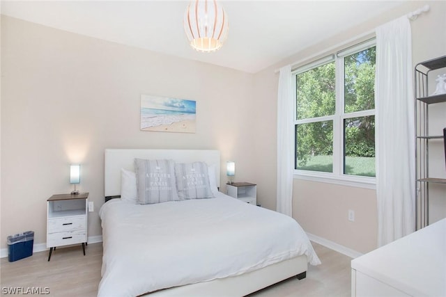 bedroom with light hardwood / wood-style floors