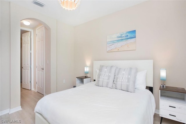 bedroom with light wood-type flooring