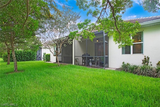 view of yard with a sunroom