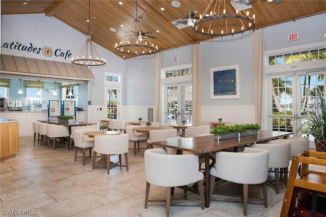 dining room with a chandelier, french doors, high vaulted ceiling, and wooden ceiling