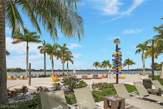 view of property's community with a water view and an outdoor hangout area