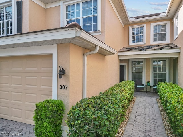 property entrance featuring a garage