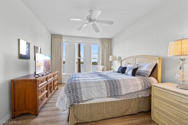 bedroom with light hardwood / wood-style floors, multiple windows, and ceiling fan