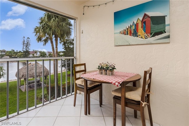 balcony featuring a water view