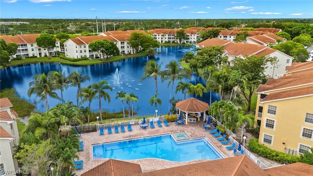 view of swimming pool featuring a patio, a gazebo, and a water view