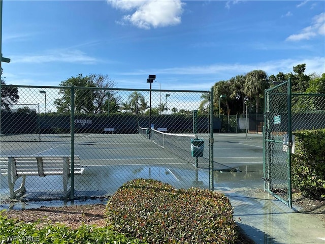 view of sport court with fence