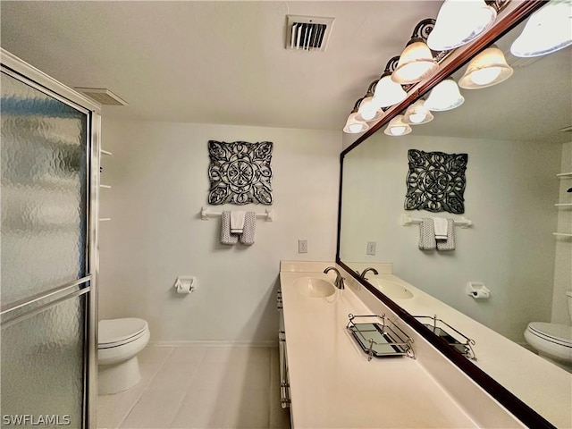 bathroom featuring baseboards, visible vents, a sink, and toilet